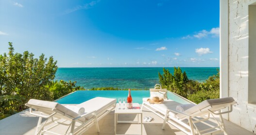 This oceanfront one bedroom suite at Rock House in Turks & Caicos features a sea-facing plunge pool.