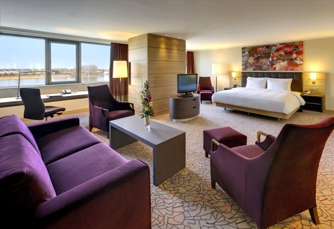 A photograph of a spacious riverview suite at the Hilton Mainz, Germany