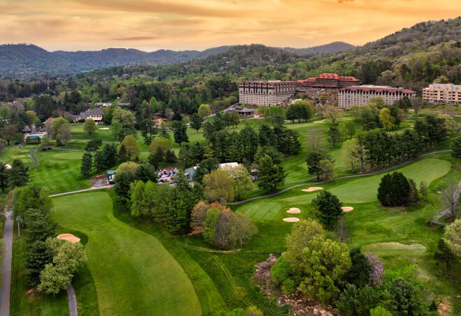 A birds-eye view of the Omni Grove Park Inn and the surrounding greenery in Asheville, North Carolina