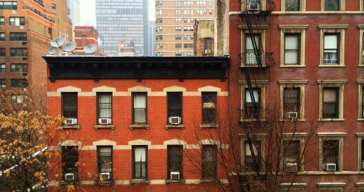 Facade of a couple classic brick apartment buildings in New York City